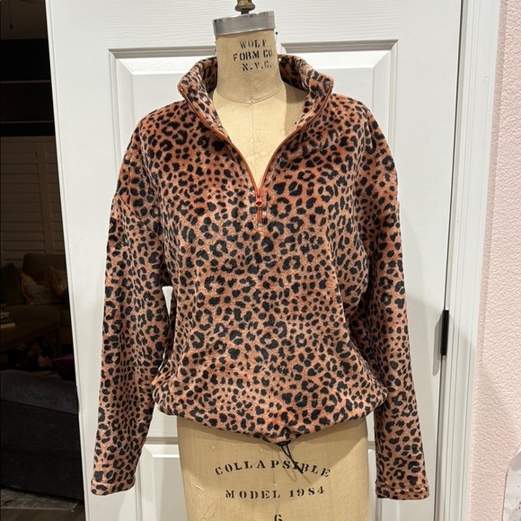 Cold Crush Tops - Cold Crush Faux Fur Animal Print half Zip top.